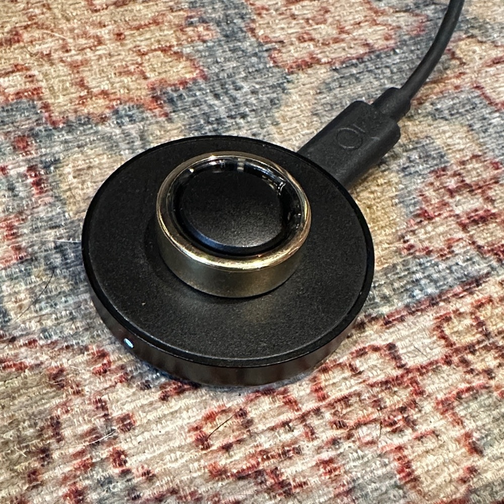 Oura Gold Ring Gen 3 with charging dock- erased and ready to pair